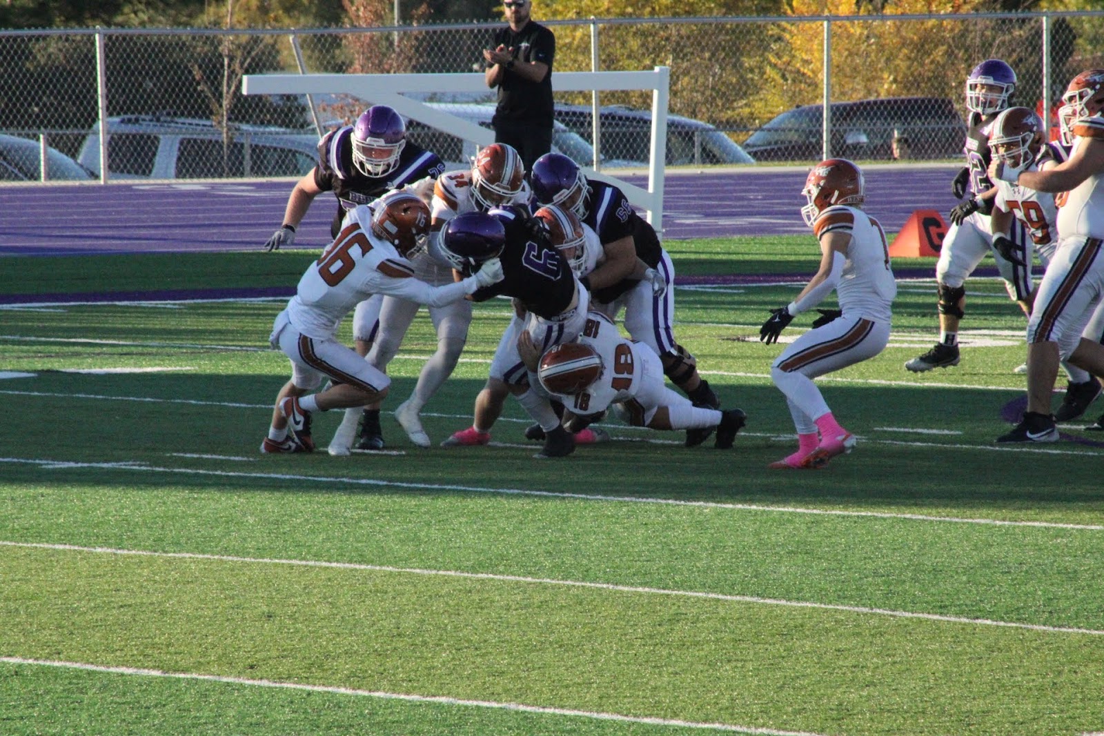 A pile of football players after a tackle near the line of scrimmage
